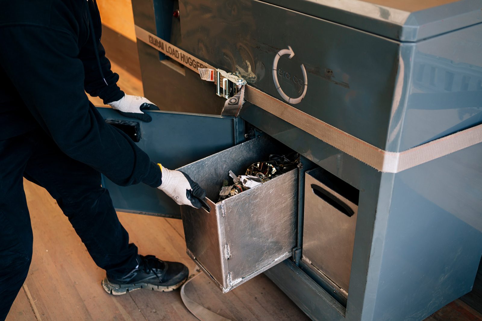 ERA technician handling the secure shredder collection drawer at a destruction event